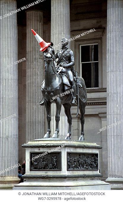 UK Glasgow -- 12 Nov 2013 -- File photo dated 12/05/1999 of the statue of the Duke of Wellington in Glasgow Scotland UK with a traffic cone placed on the...