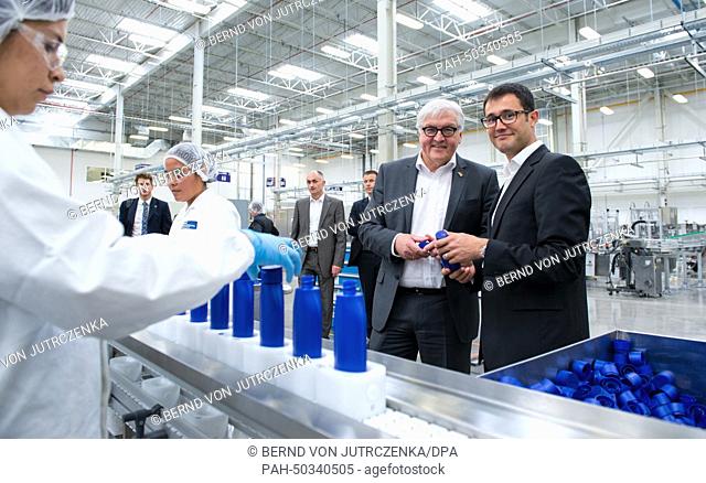 Factory manager of Beiersdorf AG Sebastian Gottschalk (R) guides German Foreign Minister Frank-Walter Steinmeier (SPD 2nd R) on a tour through the new...