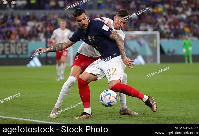 France's Theo Hernandez and Danish Jesper Lindstrom fight for the ball during a soccer game between France and Denmark, in Group D of the FIFA 2022 World Cup