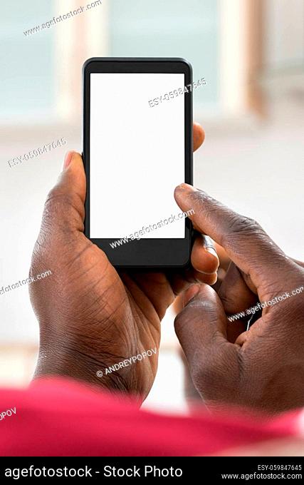 Close-up Photo Of African Man Holding Cellphone