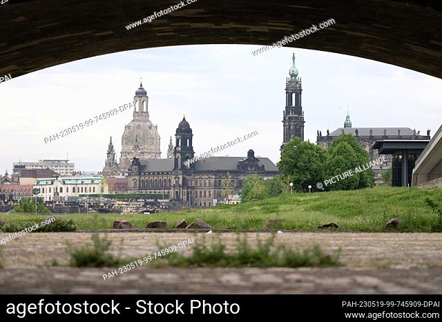 19 May 2023, Saxony, Dresden: The backdrop of the old town is framed by a bridge arch of the Marienbrücke. Photo: Sebastian Kahnert/dpa