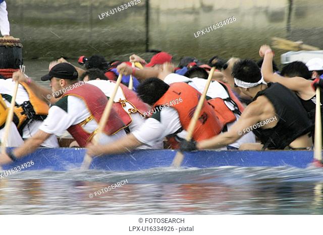 dragon boat racing in Vancouver British Columbia. There are up to 22 people in a boat. Dragon boat racing is largely used as a team building activitey for...