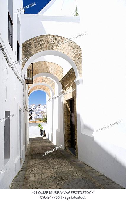 Elegant arched architecture in the narrow lanes of the picturesque village of Vejer de la Frontera, voted by the Spanish as the most beautiful village in Spain