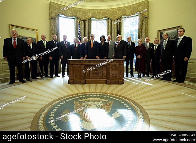 United States President George W. Bush poses for a photograph with present and former Secretaries of State and Defense in the Oval Office at the White House in...