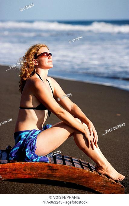 Woman sunbathing at the beach