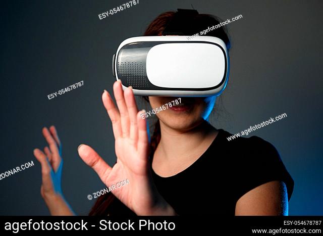 Woman using the virtual reality headset. VR concept