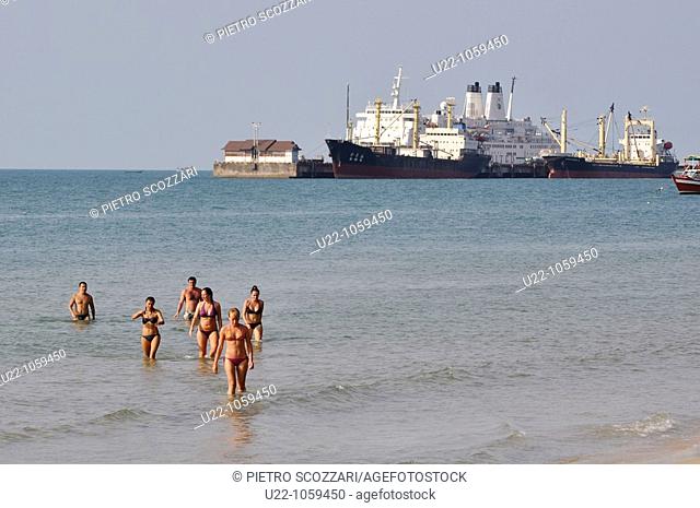 Sihanoukville (Cambodia): tourists bathing at Victory Beach, facing the port