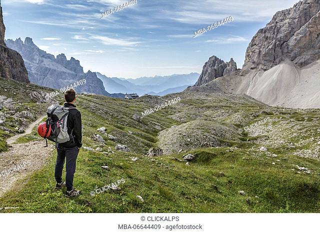 Europe, Italy, Veneto, Belluno. hiker in high Giralba valley on the way to the hut Carducci, Sexten Dolomites