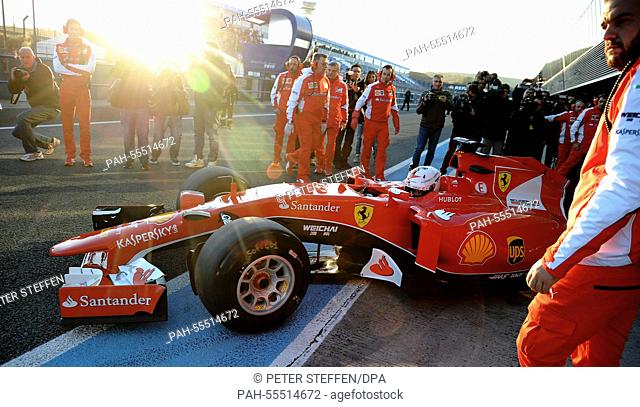 German Formula One driver Sebastian Vettel of Scuderia Ferrari steers the new SF15-T during the training session for the upcoming Formula One season at the...