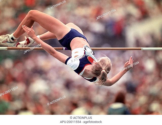 Female high-jumper clears bar on her jump