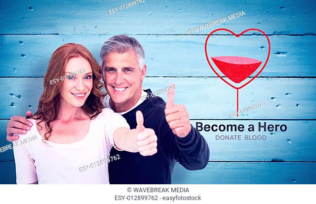Composite image of casual couple showing thumbs up