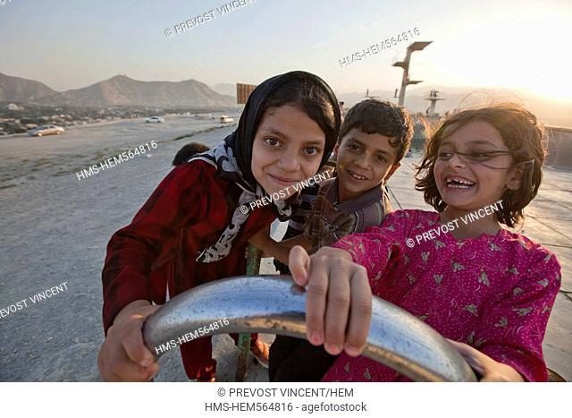 Afghanistan, Kabul, Bibi Maru Hill, young girls playing in an abandonned swimming pool