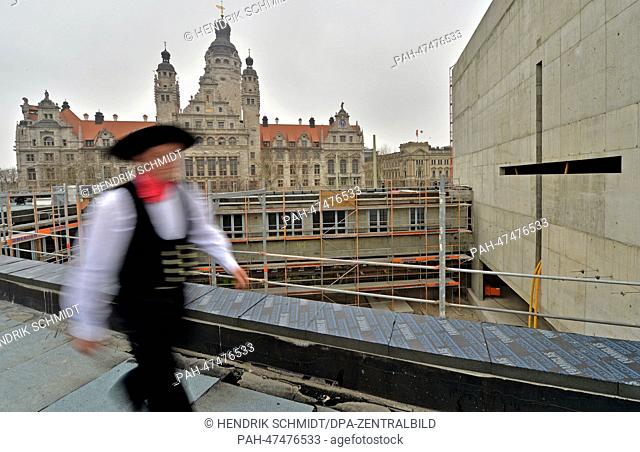The topping out ceremony for the Provost Church (Propsteikirche) is celebrated across from city hall in Leipzig,  Germany, 20 March 2014