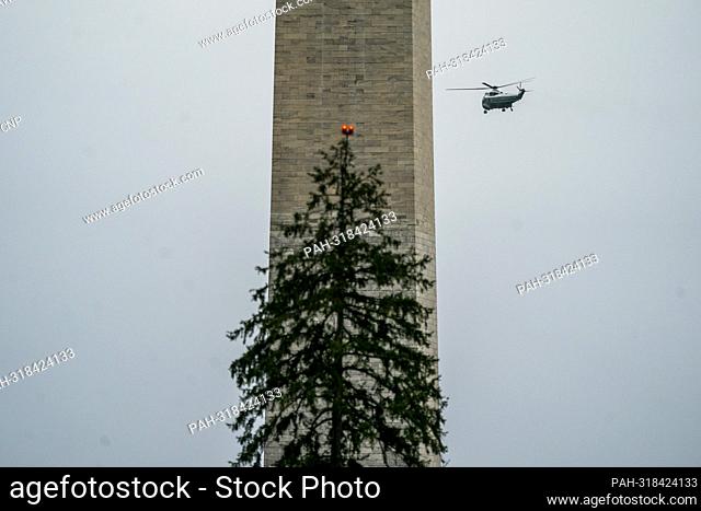 Marine One, with United States President Joe Biden and first lady Dr. Jill Biden aboard, flies near the Washington Monument after lifting off the South Lawn of...