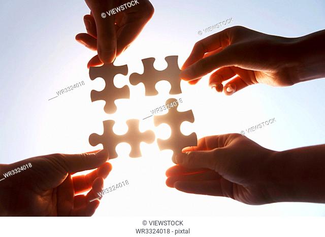 Holding a jigsaw puzzle