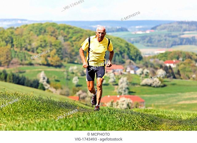 Elderly jogger training for his fitness jogging - 31/07/2009