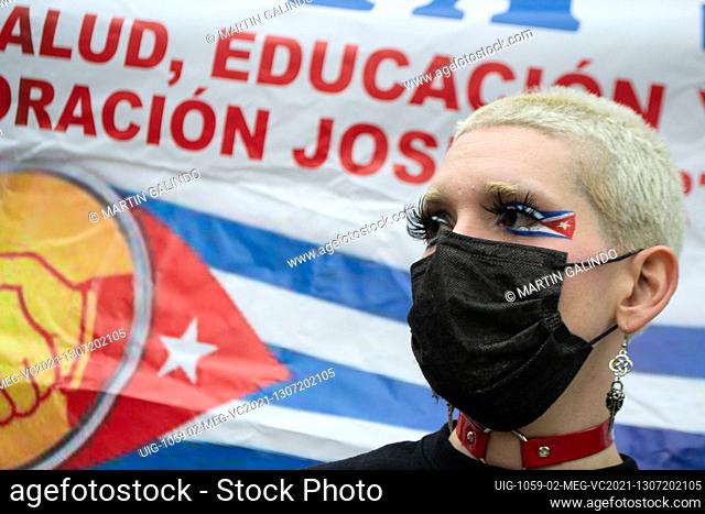 A demonstrator with make-up of Cuba's national flag as Cuban residents residing in Colombia that protest against the president Miguel Diaz-Cannel protest in...