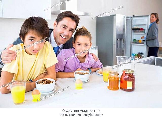 Cute family at breakfast time