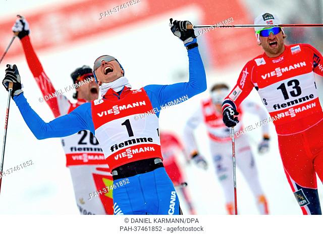 Nikita Kriukov (C) of Russia reacts after winning the Cross Country men's 1, 5 km classic sprint final at the Nordic Skiing World Championships in Val di Fiemme