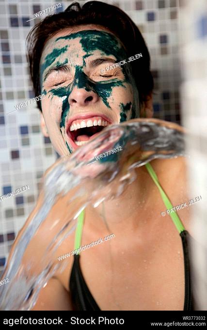 Woman cleaning her face