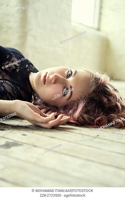 Portrait of a woman laying on the floor