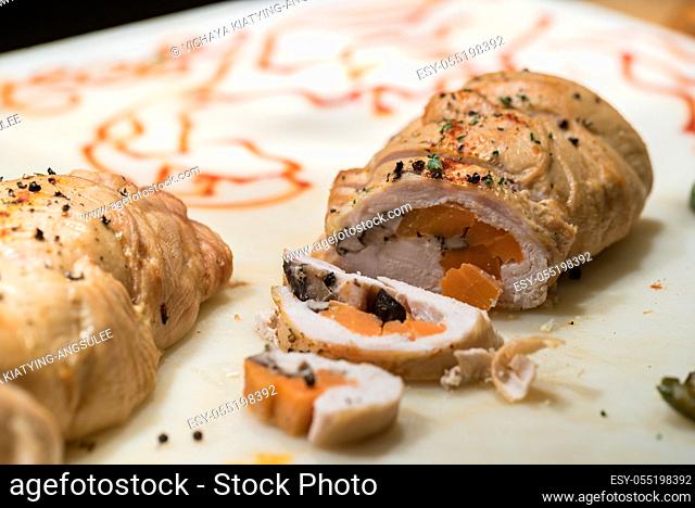 Carving of stuffed chicken breast groumet food