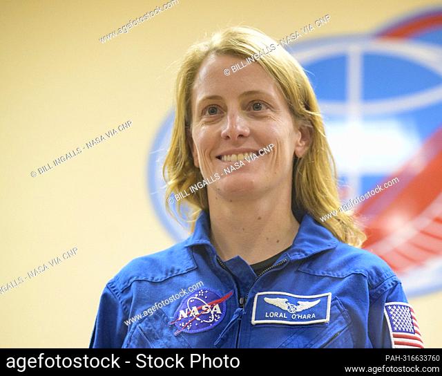 Expedition 68 backup crewmember Loral O'Hara of NASA is seen in quarantine, behind glass, during a press conference, Tuesday, Sept