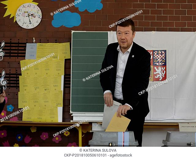 Czech politician Tomio Okamura (SPD) casts their ballots at a polling station during the First day of local elections and first round of elections to one-third...