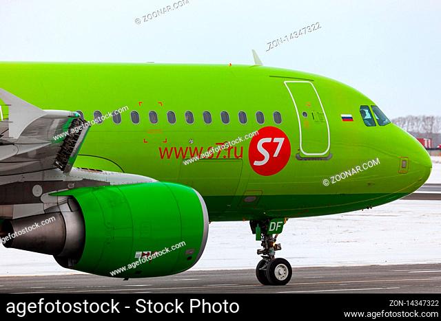NOVOSIBIRSK, RUSSIA - FEBRUARY 17, 2010: Airbus A320-214, VQ-BDF of S7 Airlines on a snowy strip at the airport of Novosibirsk Tolmachevo