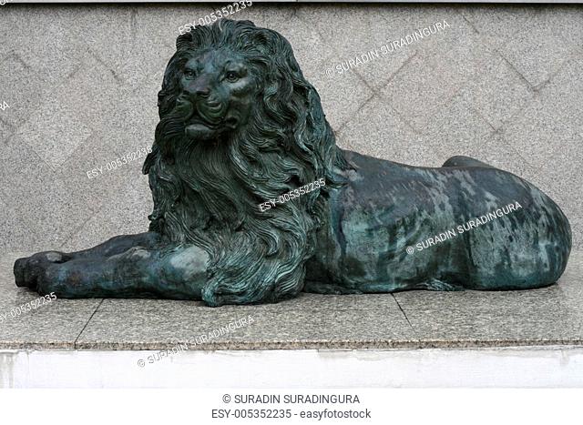 Green Lion Sculpture lean on the mable floor