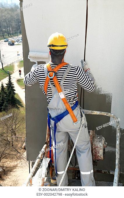 builder facade painter at work