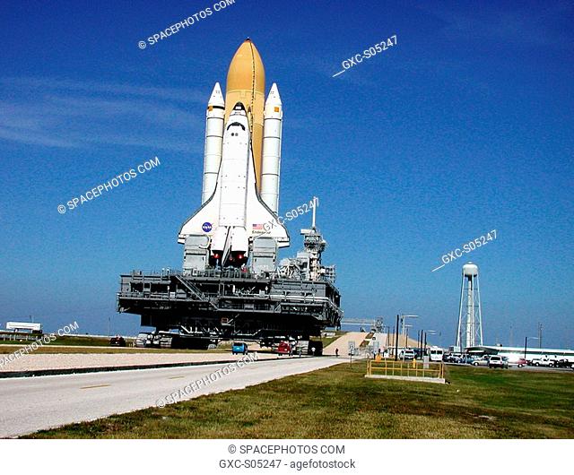 10/31/2000 -- Perched atop the Mobile Launcher Platform, Space Shuttle Endeavour approaches the gate to Launch Pad 39B. To the right of the pad is a 290-foot...
