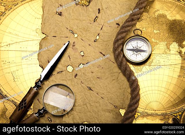 Compass on the old map background