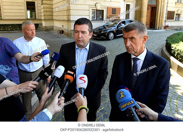 Czech Prime Minister Andrej Babis (ANO), right, and Social Democrat (CSSD) leader Jan Hamacek, center, speak to journalist after their meeting over dismissal of...