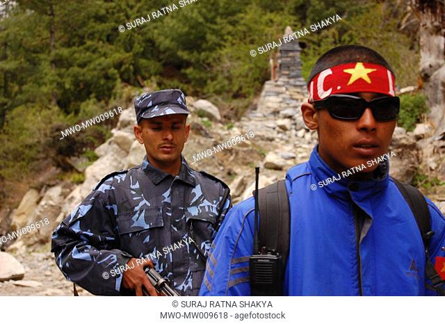After the peace deal with the Maoists, the police and YCL cadres are seen together during the arrival of a top level Maoist leader Manang, Nepal April 26, 2007