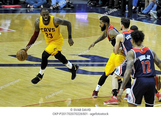 Cleveland Cavaliers forward LeBron James, left, dribbles the ball during an NBA basketball game against Washington Wizards in Washington, USA, February 6, 2017