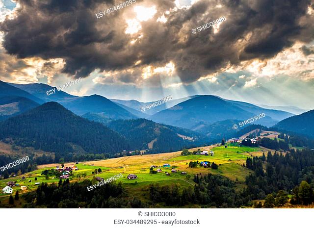 Beautiful light beam in morning with village on mountain valleys