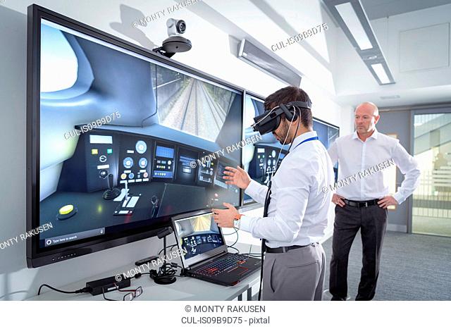 Instructor and apprentice using Virtual Reality system in railway engineering facility
