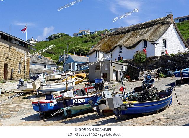 England, Cornwall, Sennen Cove. Fishing boats drawn up on the slipway at Sennen Cove in Cornwall