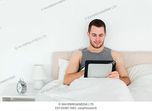 Beautiful man using a tablet computer