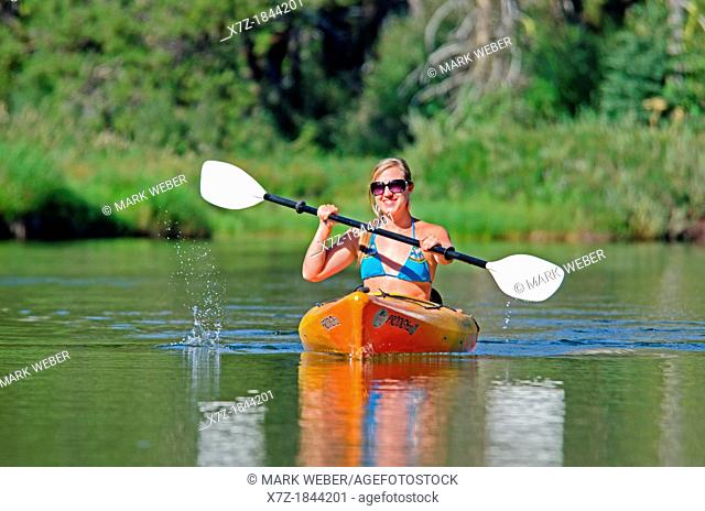 Kayaking on the North Fork of the Payette River near Payette Lake and the city of McCall in the Salmon River Mountains of central Idaho