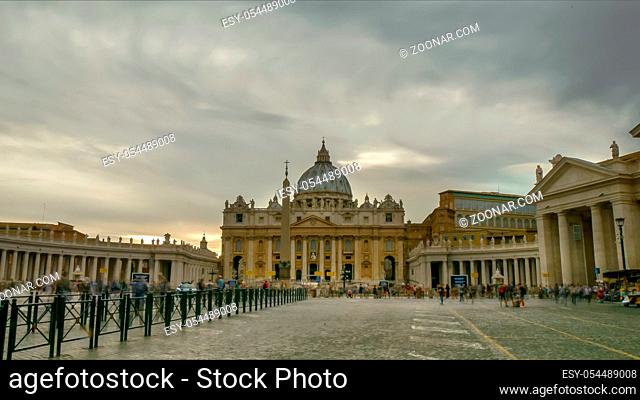 long exposure shot of tourists and storm clouds above st peter's basilica in vatican city