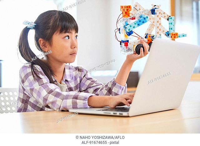 Japanese kid practicing programming