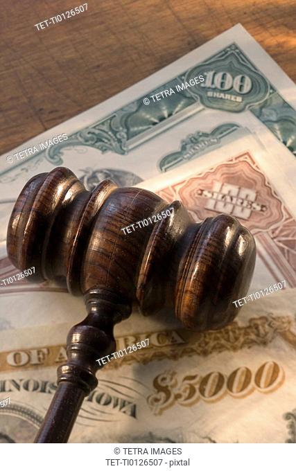 Judge’s gavel on bank notes
