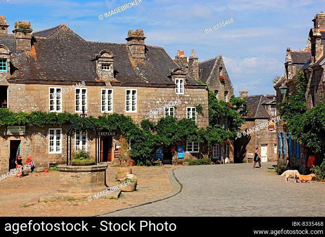 Houses in the medieval village of Locronan, fountain at the market place, Brittany, Fr, FranceAngland