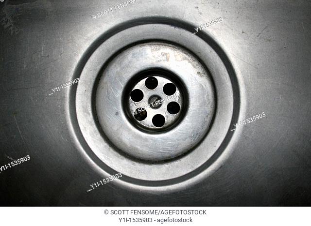 image of gray metallic plughole in sink