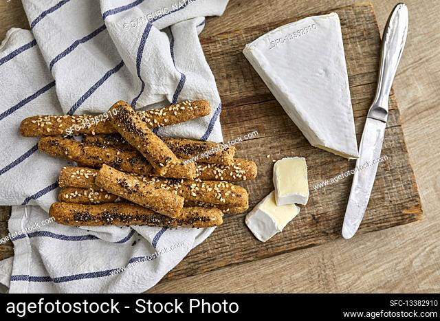 Gluten free breadsticks made with almond flour, ground flax and parmesan cheese served with brie