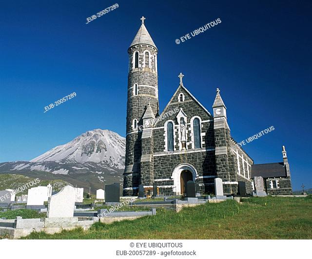 Roman Catholic church and graveyard with Errigal peak of the Derryveagh Mountain Range behind