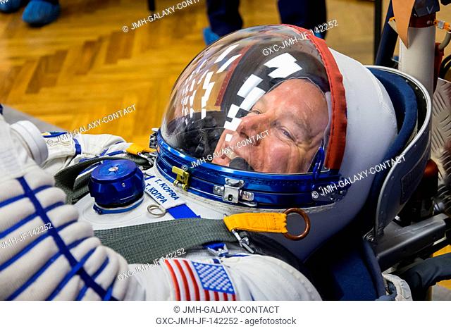 In the Integration Facility at the Baikonur Cosmodrome in Kazakhstan, Expedition 46-47 crewmember Tim Kopra of NASA flashes a smile as he conducts a pressure...