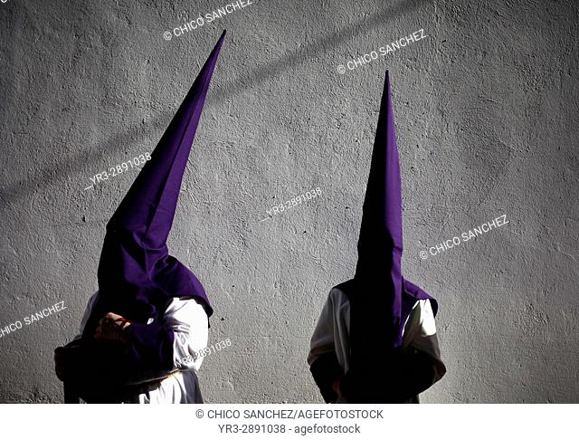 Penitents wearing pointed hoods during Easter Week celebrations in Baeza, Jaen Province, Andalusia, Spain